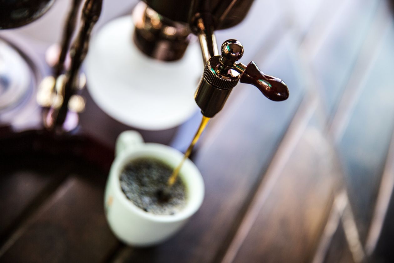  A siphon coffee maker pours a jolting cup at Black Ivory Coffee in Ban Taklang village in Thailand. Photo: Taylor Weidman/Bloomberg News
