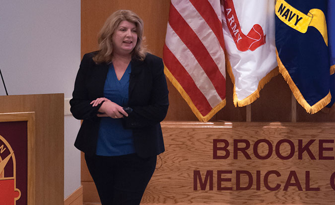 At BAMC’s Research Open House, Ms. Holly Pavliscsak educates attendees on the AAMTI Program, its processes and how to obtain funding.