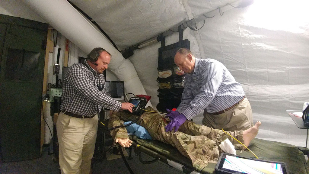 Mr. James Beach (left) and Mr. Tom Bigott (right) evaluating a telemedicine system for use in operational environments.