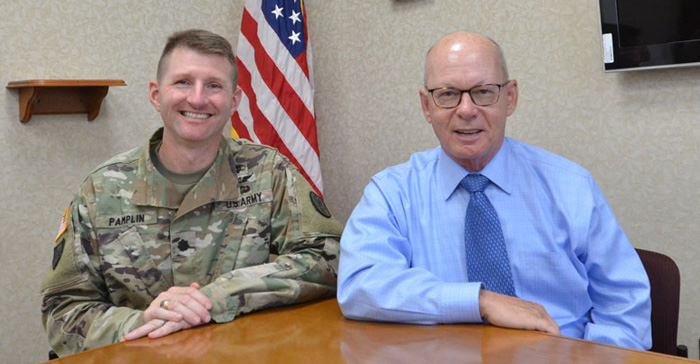 TATRC’s new incoming Deputy Director, LTC (P) Jeremy Pamplin (left) and TATRC’s outgoing Deputy Director, Mr. Timothy McCarthy (right) sit down to chat about the organization and to pass the baton. 