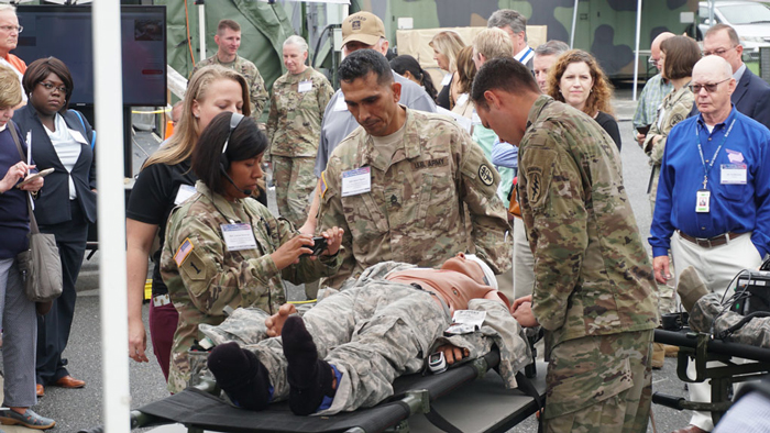 Medics relay patient data and receive feedback remotely from a doctor in real time.