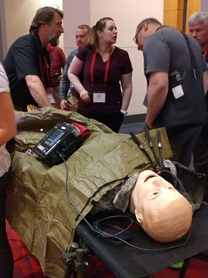 Mr. Geoff Miller, TATRC’s Senior Research Scientist and Lab Manager for MMSV provides a hands on simulation demonstration during the exhibit at SOMSA. 