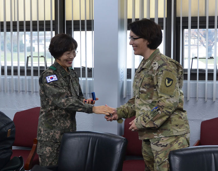 COL Adam, presenting parting gifts in appreciation of Mr. Harvey Magee’s contributions to TATRC. 