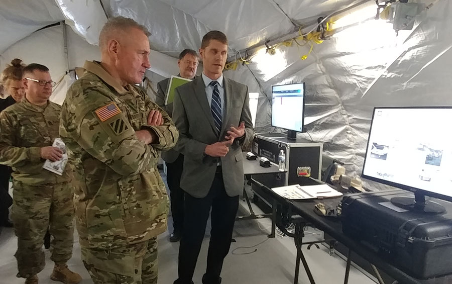 MISL Lab’s Nathan Fisher (Right) briefs and highlights the research and development taking place in the field of medical robotics and unmanned systems to AFC Commander, General John Murray (3rd from left) during a VIP tour.
