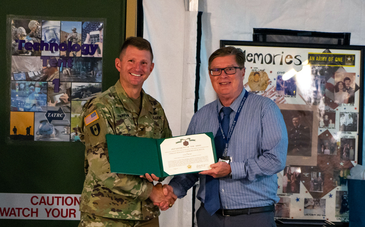 Dr. McVeigh receiving an award from COL Pamplin.