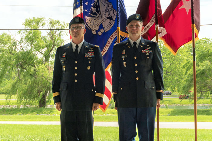 BG Michael Place and TATRC Director, COL Jeremy Pamplin, stand at attention during COL Pamplin’s promotion ceremony.