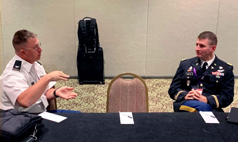 COL Jeremy Pamplin (right) shares ideas on new initiatives in Medical Modeling and Simulation with COL Scott MacIntosh (left).