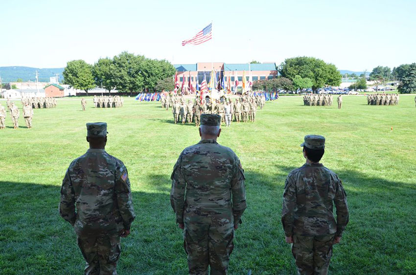 From left to right: MG Holcomb, GEN Murray and BG Talley salute the Command Units.