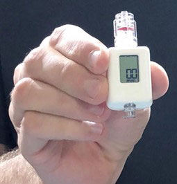Figure 1. The COMPASS® device from Centurion Medical Products. Compact, disposable, battery powered mean arterial pressure monitor.