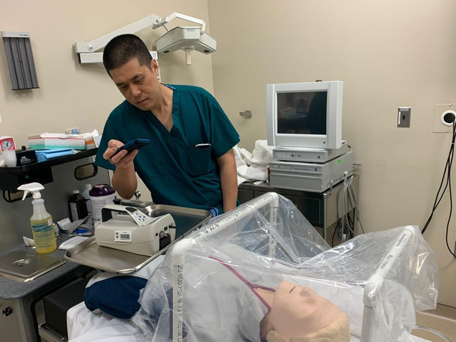 Army Maj. (Dr.) Steven Hong, chief of Head and Neck Surgical Oncology at Walter Reed National Military Medical Center, tests the effectiveness of the CAMIC in late March. Hong was one of the device’s inventors. (Photo by Capt. [Dr.] Timothy Blood Jr.)