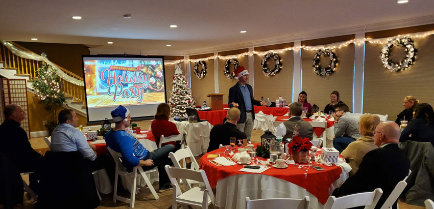 Director and “Holiday Head Honcho,” COL Jeremy Pamplin, spreads good tidings to the team.