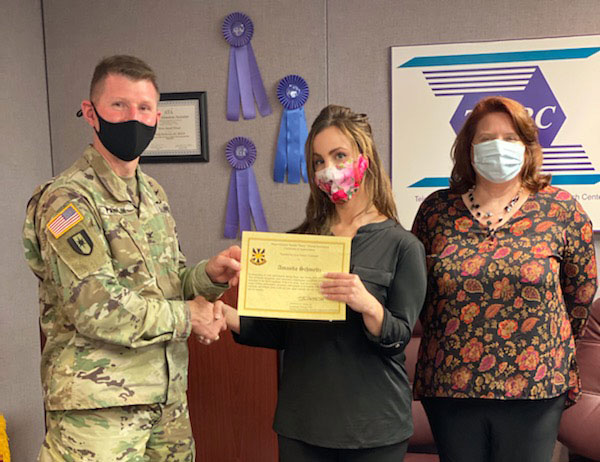 TATRC Director, COL Jeremy Pamplin (left) along with DHIC Division Chief, Ms Jeanette Little (right), presented Ms. Schmeltz (center) with a Cerftificate of Appreciation & Excellence during a recent site visit to the Fort Gordon office. The certificate was presented in recognition of her five years of contributions to the TATRC Mission.