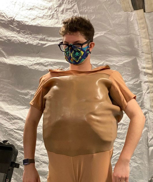 MMSIV Human Factors Engineer, Mr. James “Jimmy” Gaudean puts on the TCCC CutSuit vest and skin.