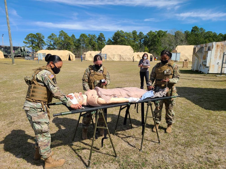 TATRC personnel staged simulation mannequins with combat wounds for medics at Fort Gordon to treat and assess.