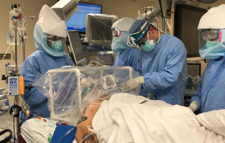 Figure 5. Use of the CAMIC during tracheostomy surgery. Pictured LTC Steven Hong; Photo Courtesy of CPT Nathan Perkins.