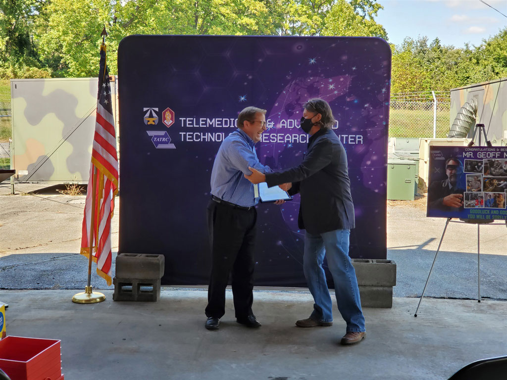 Mr. Quinn, TATRC's Science Director (left), stated, 'Geoff’s legacy is embedded everywhere you look here at TATRC.'