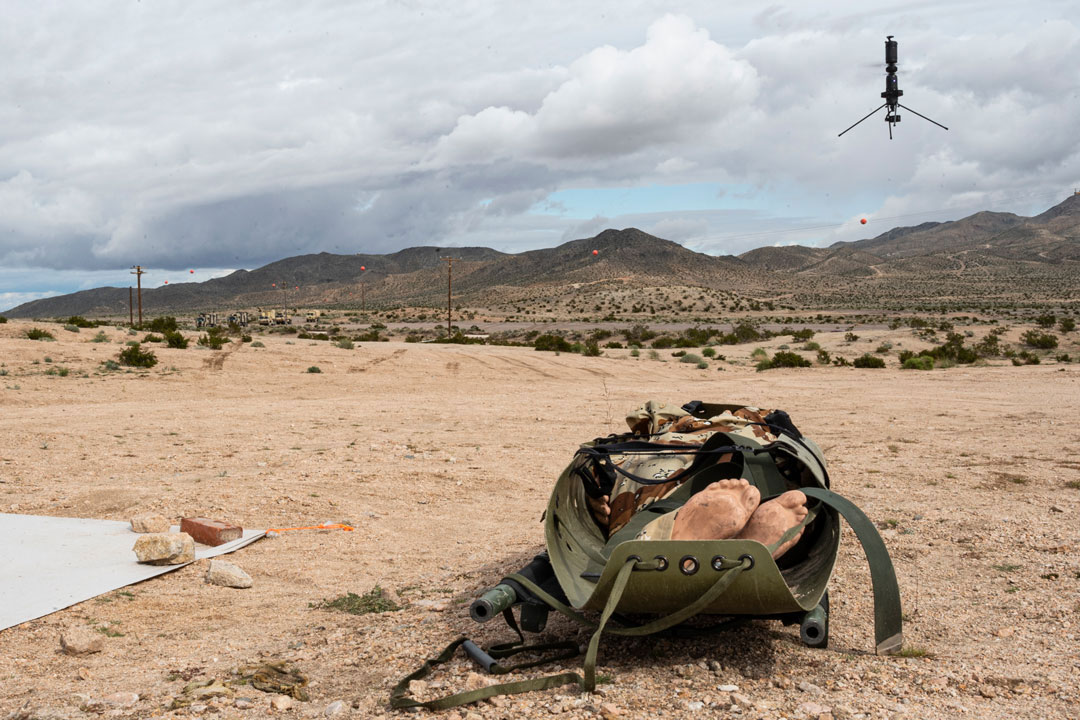 A small unmanned aircraft system (s-UAS) component of the Vision and Intelligence Systems for Medical Teaming Applications (VISTA) hovers while gathering information from notional casualties during the medical experimentation portion of Project Convergence Capstone 4 (PC-C4), Fort Irwin, Calif., March 16, 2024. 