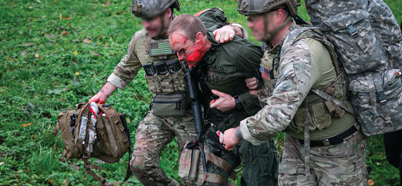 U.S. Army Special Forces Soldiers assigned to 19th Special Forces Group (Airborne) perform TCCC (Tactical Combat Casualty Care) on a simulated casualty during a joint training exercise in Lithuania, Oct. 21, 2021. Special Operation Forces Soldiers from Lithuania, Latvia, Estonia and Poland provided life saving techniques and strategies for trauma care on the battlefield, this training is crucial because it teaches the procedures that must be administered when providing aid with NATO partners and allied forces. (U.S. Army photo by Sgt Stanford Toran)