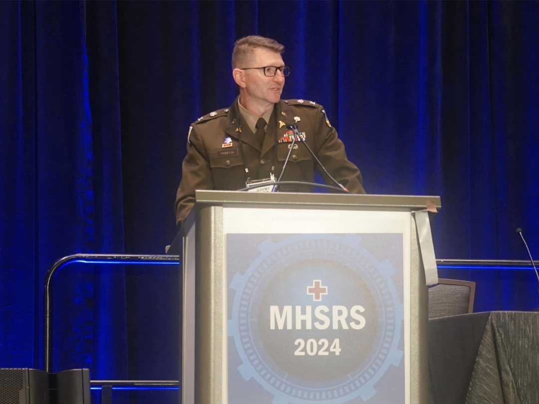 Photo of COL Pamplin speaking at MHSRS