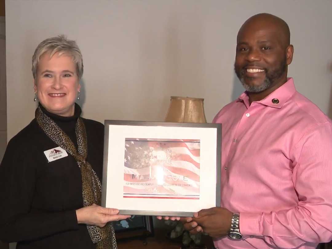 Photo of Marvin Cole receiving the Salute to Service Award